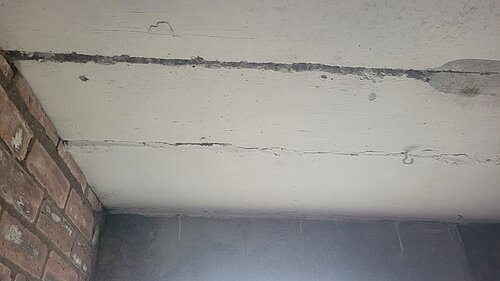 Dangerous crack in ceiling due to RAAC